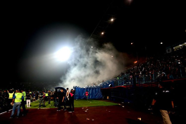 Ominous: A cloud of tear gas rises over the stands at Kanjuruhan Stadium in Malang, East Java, after the match between home team Arema FC and rival Persebaya Surabaya on Oct. 1. (Kompas.com/Suci Rahayu).