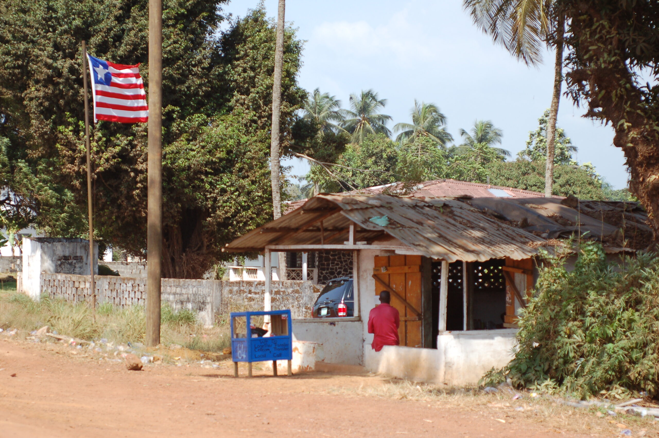 The Liberian flag waves above a building.