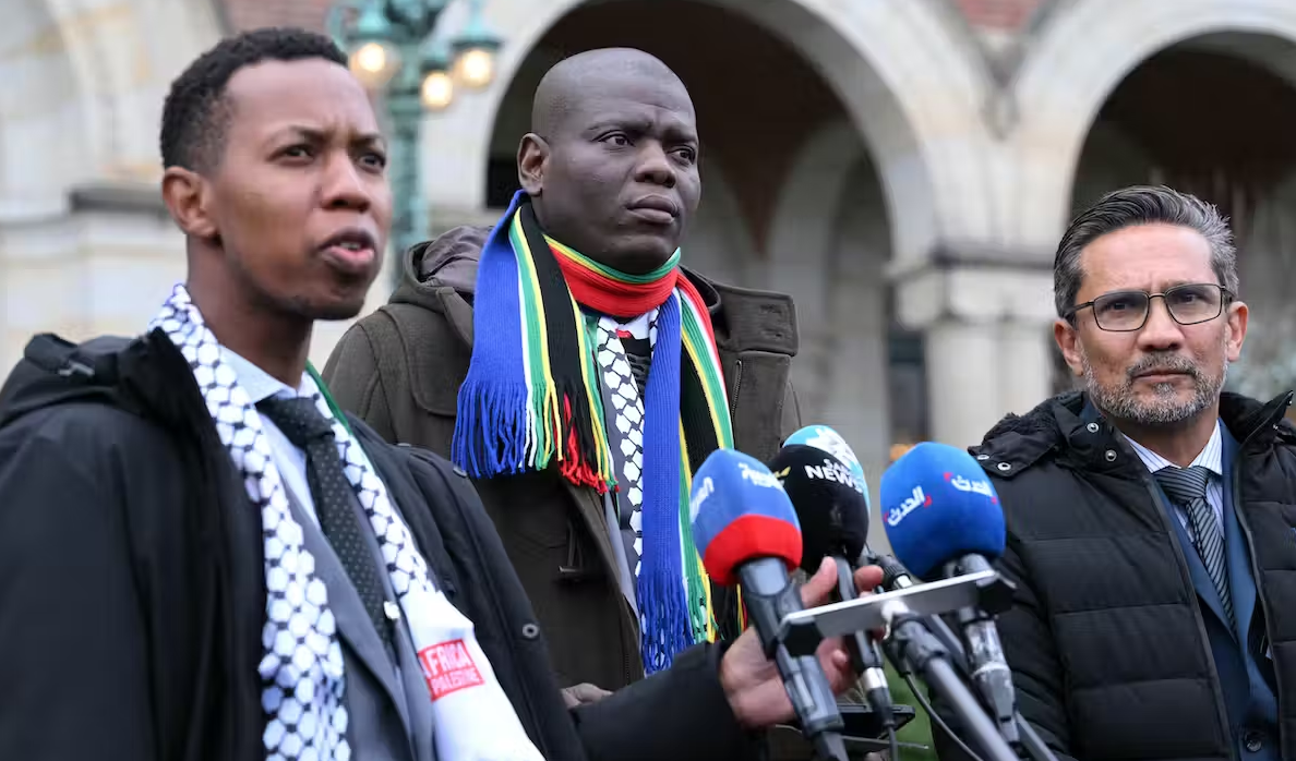 Ronald Lamola, South Africa’s minister of justice and correctional services, center, speaks to the press outside the International Court of Justice in The Hague, Netherlands, on Jan. 12, 2024. Dursun Aydemir/Anadolu via Getty Images