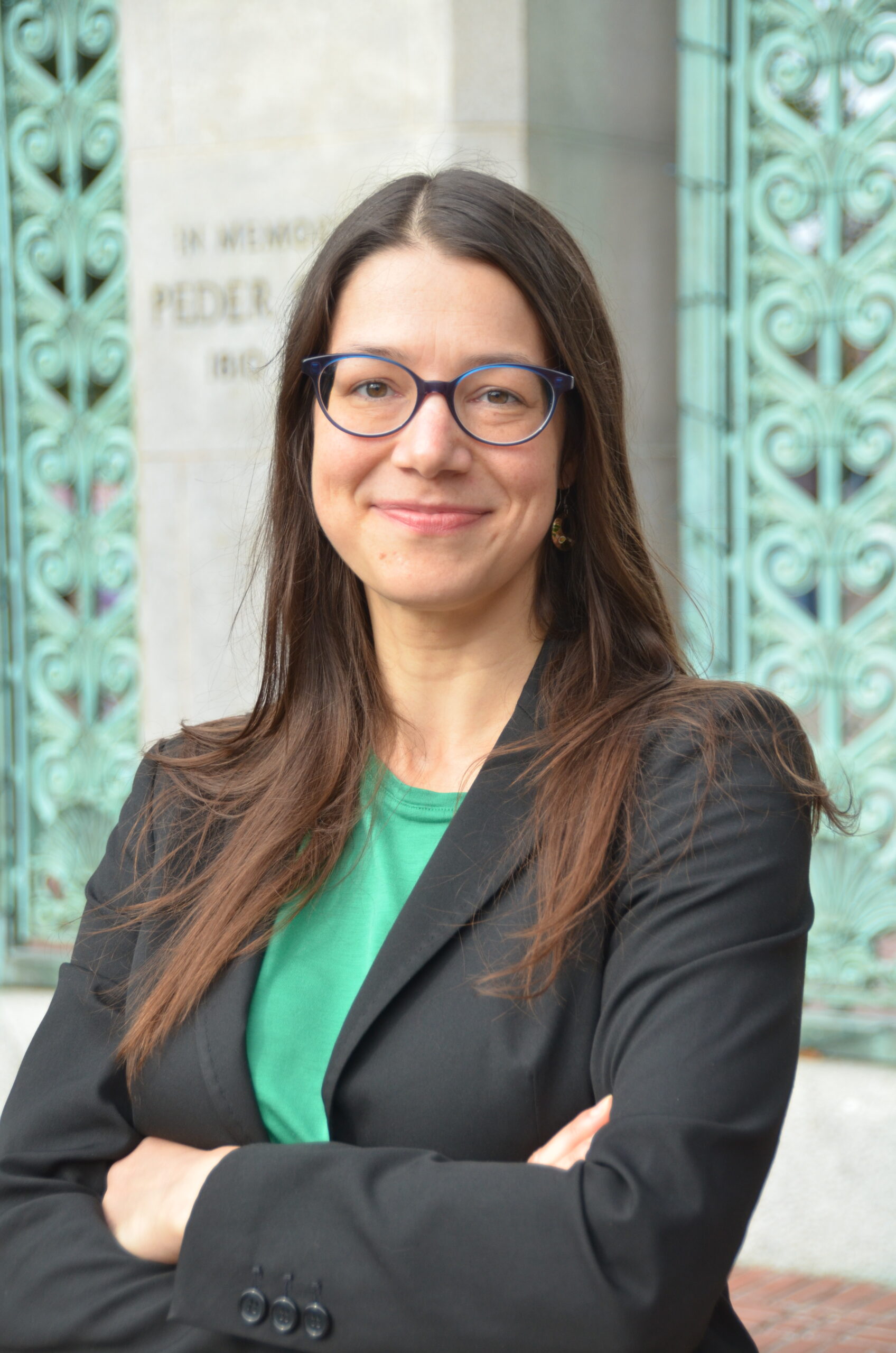 A woman smiles at the camera.